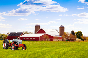 iStock_000026543883_Full_300 image Traditional american red farm with tractor